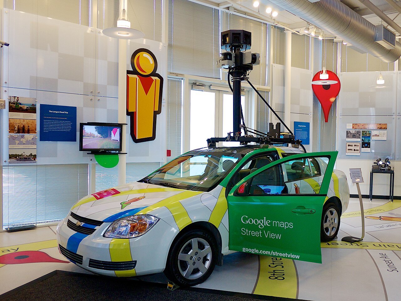 A Google Street View car with its roof-mounted camera mast raised